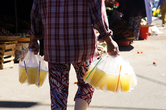 To make better sale, even sugarcane juice sellers wander around looking for customers who usually are sellers at the market.