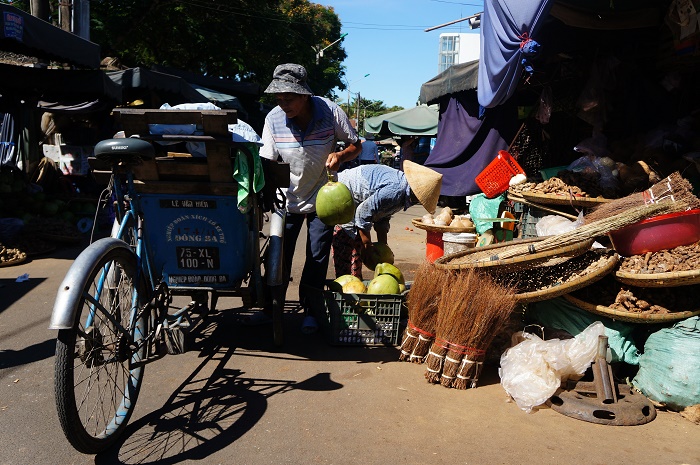 Beside motorbikes, cyclo is one of the primary vehicles to transport goods around the town.